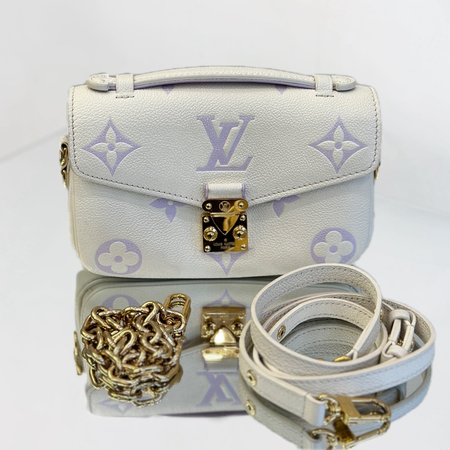 Louis Vuitton Pochette Métis East West in Monogram Empreinte Leather - White/Lilac