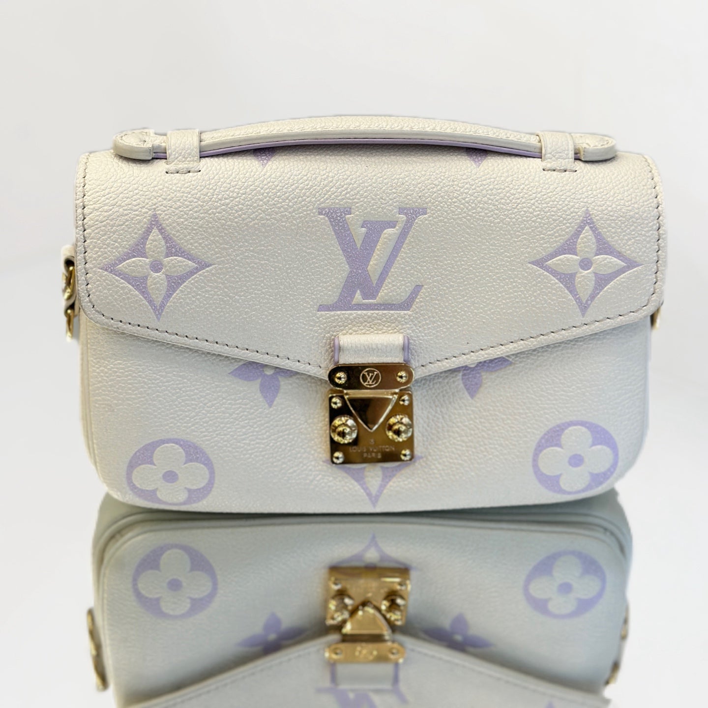 Louis Vuitton Pochette Métis East West in Monogram Empreinte Leather - White/Lilac