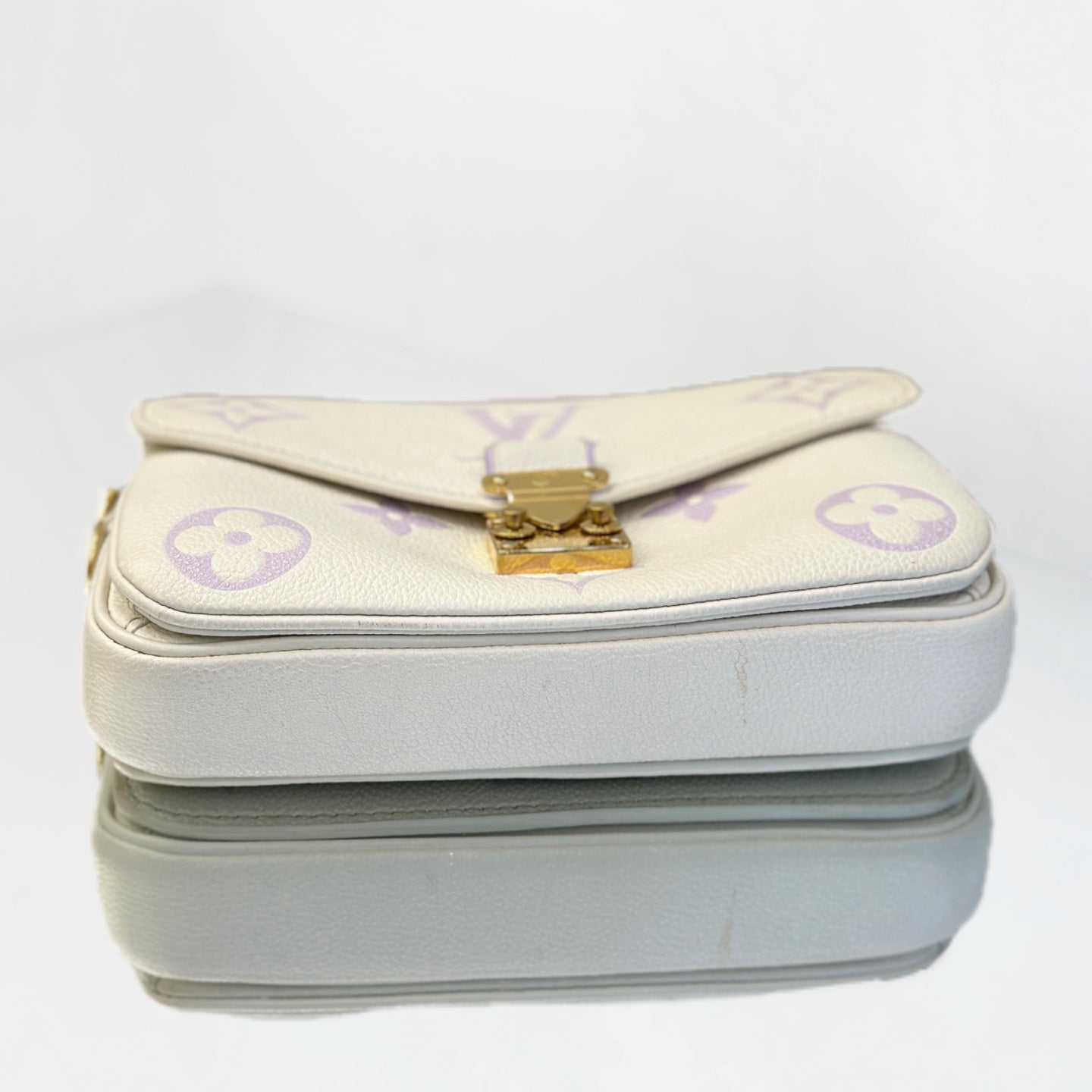 Louis Vuitton Pochette Métis East West in Monogram Empreinte Leather - White/Lilac