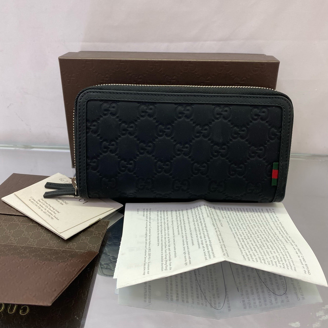 Gucci Signature Zip Around Wallet – Black Debossed Guccissima Leather
