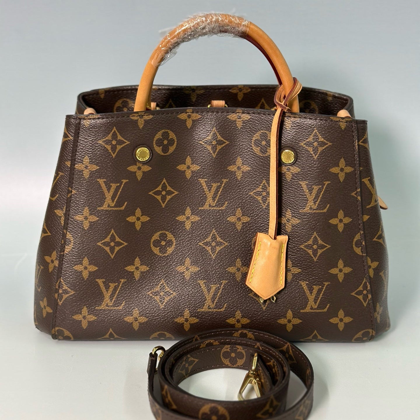 Louis Vuitton Montaigne BB – Monogram Canvas Top Handle Bag with Vachetta Leather Trim and Crossbody Strap