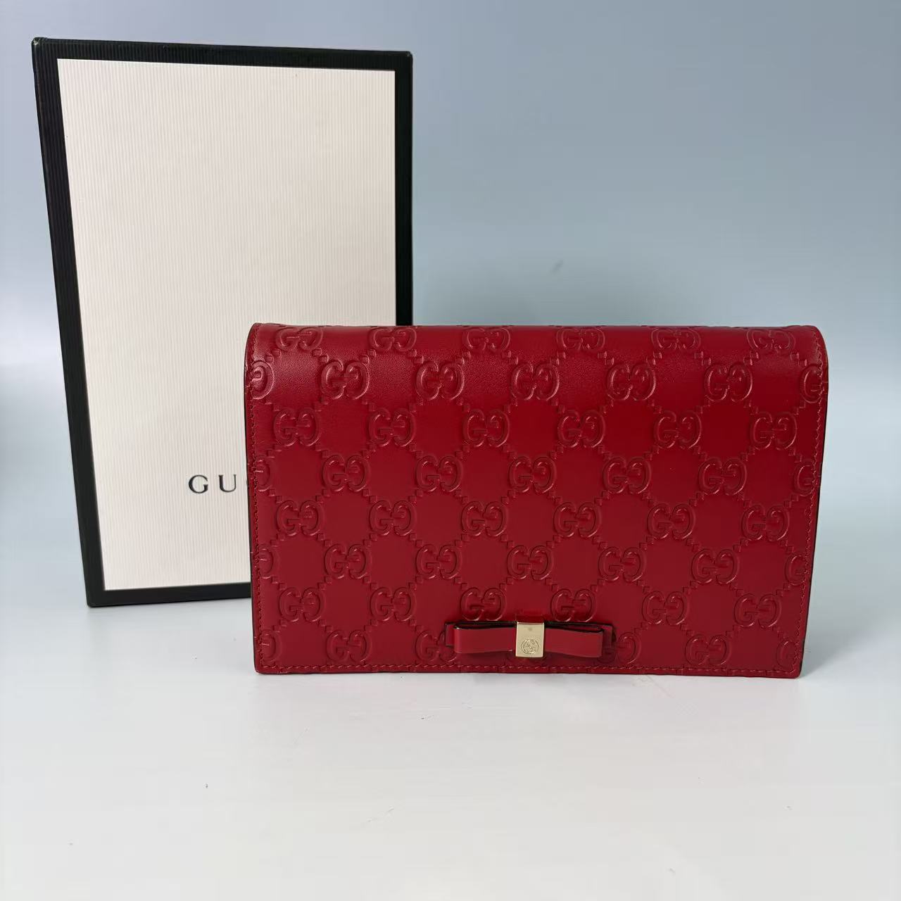 Gucci Signature (Guccissima) Leather Bow Chain Wallet in Red