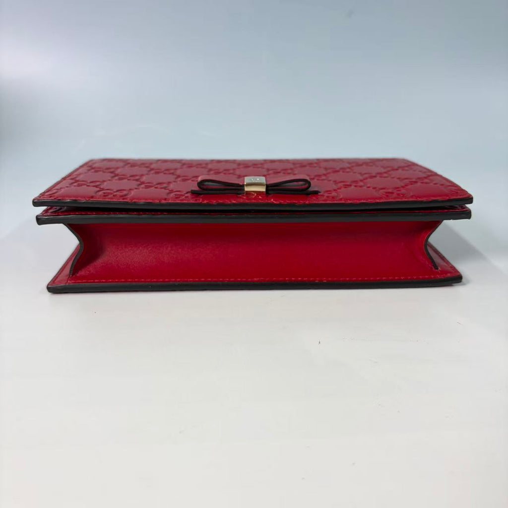 Gucci Signature (Guccissima) Leather Bow Chain Wallet in Red