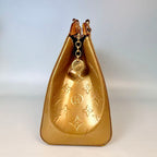 Louis Vuitton Monogram Vernis Brea in Gold