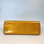 Louis Vuitton Monogram Vernis Brea in Gold