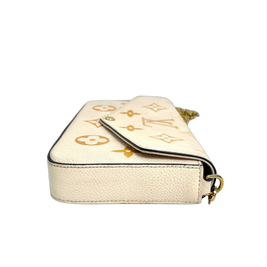 Louis Vuitton Monogram Empreinte Félicie Pochette in Cream/Saffron