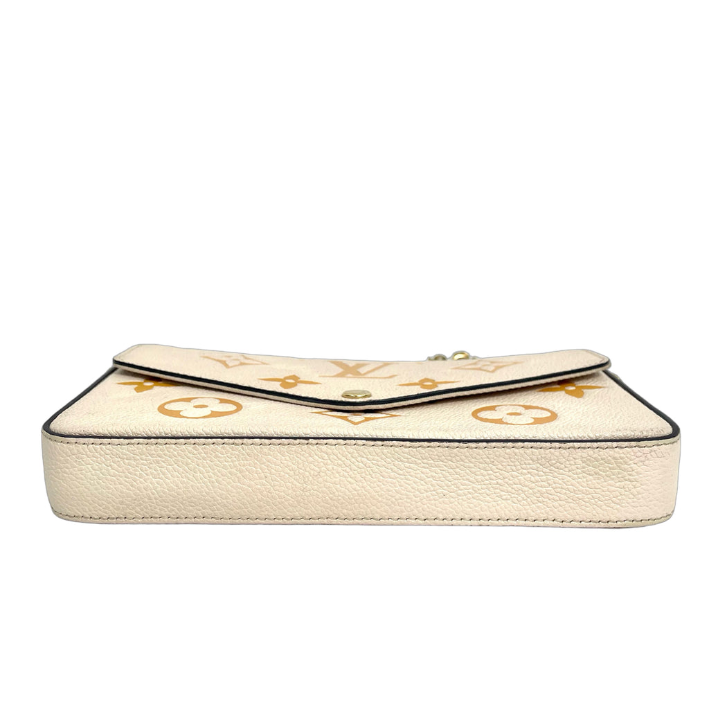 Louis Vuitton Monogram Empreinte Félicie Pochette in Cream/Saffron